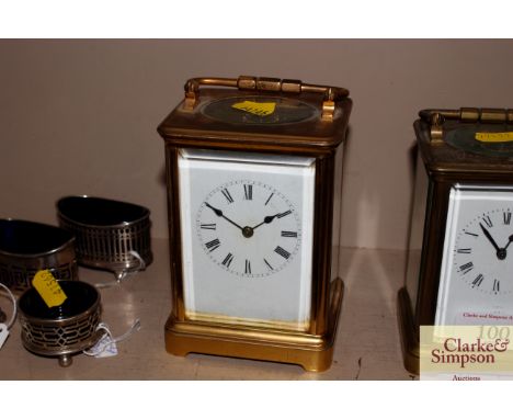 A brass cased striking carriage clock complete with key