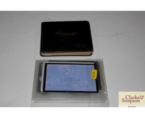 A vintage autograph and sketch book; and a memorium card 