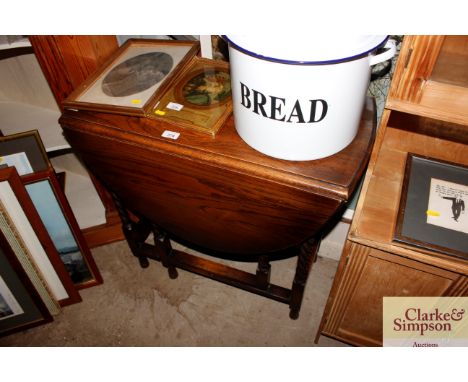 A small oak barley twist gate leg dining table 