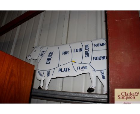 An enamel cow sign 