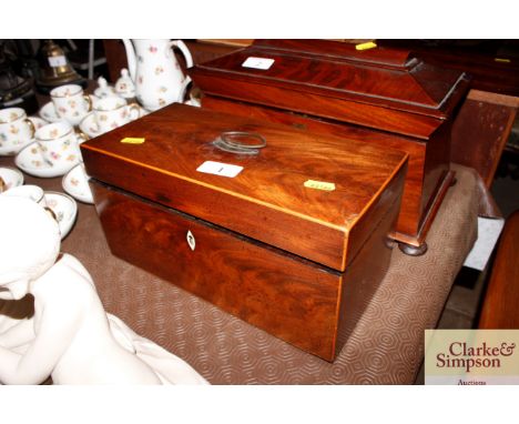A Georgian mahogany and boxwood strung two compartment tea caddy with mixing bowl and caddy spoon
