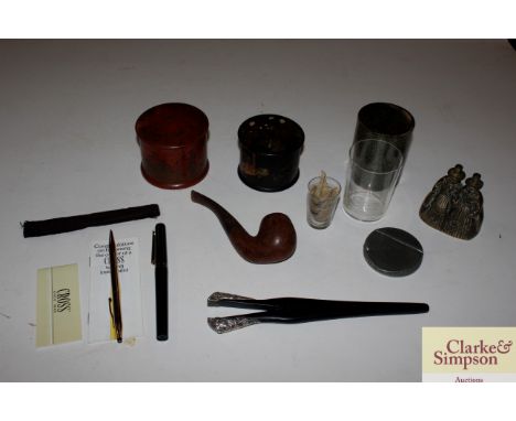 A box and contents to include trinket boxes, glove stretchers, an old pipe, pens etc. 