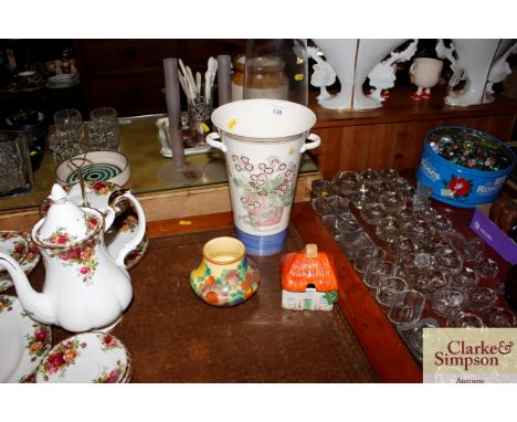 A Wedgwood "Sarah's Garden" pattern vase; an Art Deco floral pattern baluster vase; and a Carltonware cottage preserve pot 