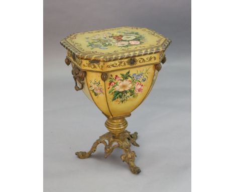 An unusual Victorian Pontypool toleware purdonium, with cast iron loop handles and cast iron tripod foot, painted throughout 