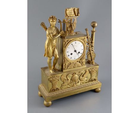 A 19th Century French Empire style ormolu mantel clock, modelled with a figure of Odysseus standing beside a plinth with vari