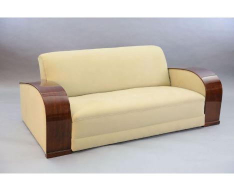 An Art Deco style mahogany and suede three piece suite, settee W.6ft 6in. D.3ft 4in. H.2ft 6in.CONDITION: Timber in high stat