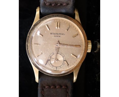 A gentleman's 18k gold Patek Philippe &amp; Co manual wind wrist watch, the rose gold coloured dial with baton numerals and s