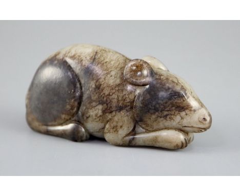 A Chinese grey and black jade figure of a recumbent mouse, 7.7cm longCONDITION: The stone with natural inclusions and veining