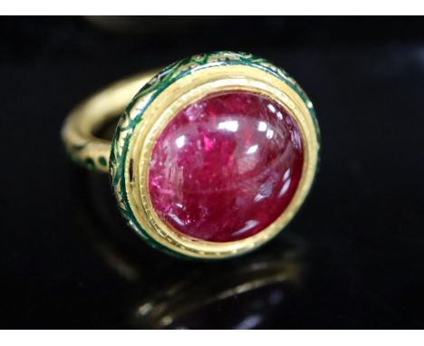 An antique Mogul gold, green enamel and cabochon natural red spinel set ring, with GCS report dated 19/6/20, stating the appr