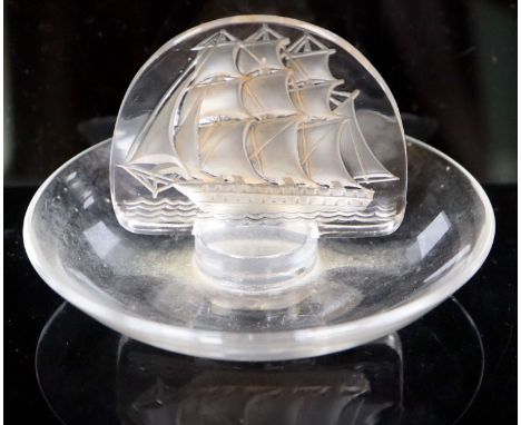 René Lalique. A pre-war amber tinted glass Caravelle pattern cendrier, no.312, designed in 1930, etched mark R LALIQUE, 10cm 