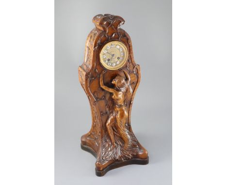 An unusual French Art Nouveau walnut mantel clock, carved in relief with a wood nymph dancing amongst mistletoe, eight day Ja