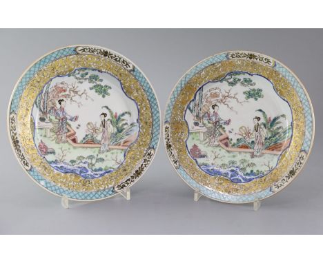 A fine pair of Chinese famille rose plates, Yongzheng period, each painted with two ladies in a rockwork garden with precious