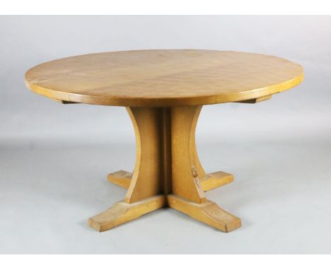 Robert Thompson "Mouseman". An adzed oak centre table, with circular top and saltire underframe carved with a mouse, Diam.4ft