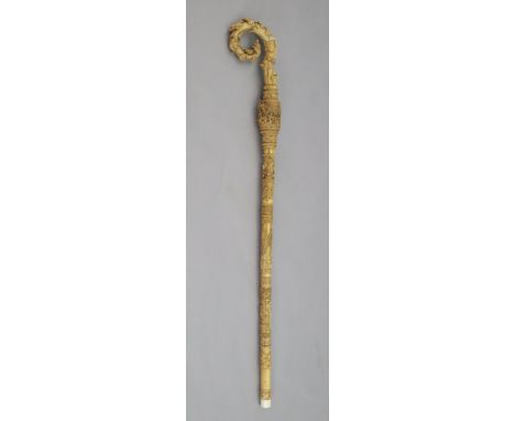 A 19th century Dieppe carved ivory crozier, thought to be a copy of a 13th century example, and profusely decorated with foli