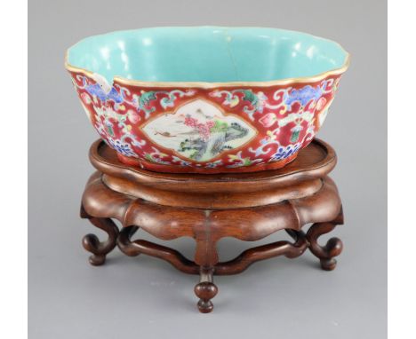 A Chinese ruby ground jardiniere, Daoguang mark and of the period (1821-50), of ruyi head outline, painted to four reserves w