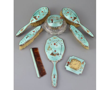 A 1920's silver and gilded chinoiserie guilloche enamel eight piece dressing table set, by Adie Bros, comprising a hand mirro