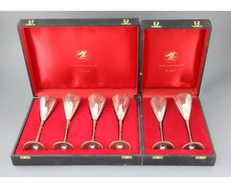 A set of six modern Stewart Devlin parcel gilt silver goblets (Senior Falcon Award 1979 &amp; 1980) in two fitted cases (4 &a