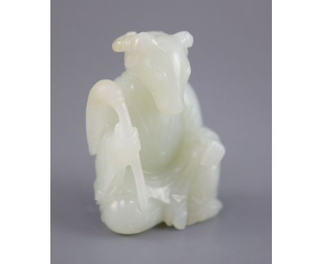 A Chinese pale celadon jade seated figure of a ram-headed immortal, seated wearing flowing robes and holding fly whisk, the s