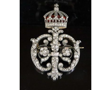 A late 19th/early 20th century Austro-Hungarian 580 standard gold and silver, rose cut diamond and enamel scroll brooch, with