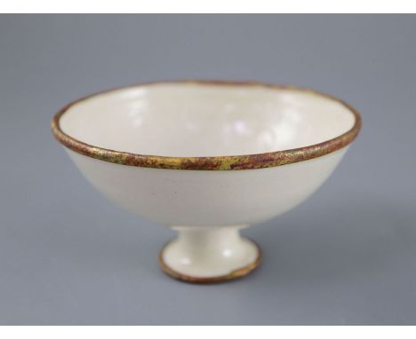 A Chinese Ding ware moulded stem bowl, Song-Jin dynasty or later, the interior relief moulded with flowering and fruiting bra