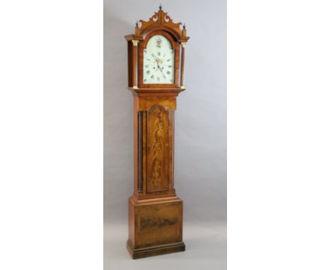 Muzzell of Horsham. An early 19th century mahogany eight day longcase clock, the 12 inch arched painted dial with date apertu