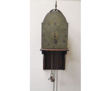 Nathaniel Cavell of Ipswich. A late 18th century brass lantern clock, with arched foliate engraved Roman dial, single hand an