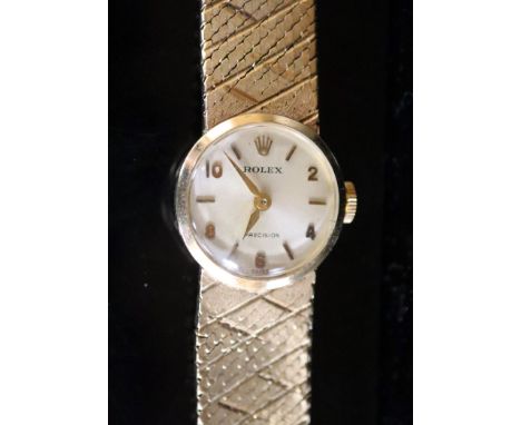 A lady's 1960's 9ct gold Rolex Precision manual wind wrist watch, with baton &amp; Arabic numerals, on integral 9ct gold brac