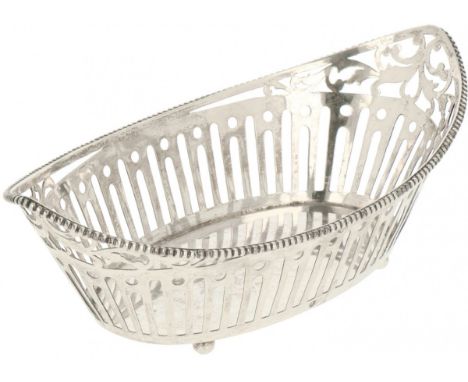 Sweatmeat basket silver. Openwork openwork and provided with soldered pearl rim and ball legs.&nbsp;The Netherlands, Rotterda