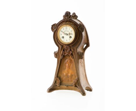 A Zamak Art Nouveau mantelpiece, France, ca. 1910. Dial painted with flowers and portrait in relief in the case. Meas. , W: 2