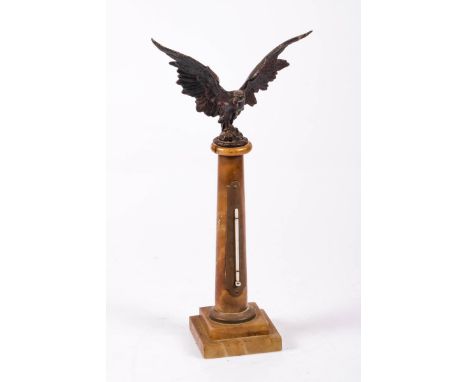 A thermometer, mount on a column, Germany, 1st half 20th century. Crowned with an eagle spreading his wings and with a snake 