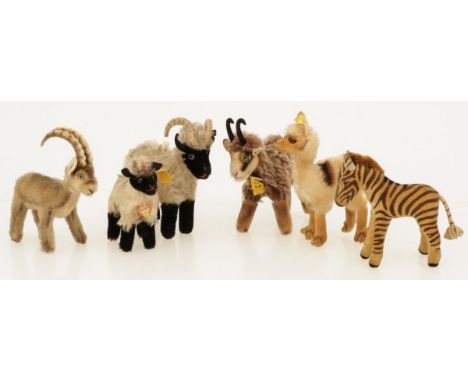 A lot comprising of (6) vintage Steiff animals. A.w. Llama: 1317,00 (1957-1969); a Goat: 6317.00 (1961-1967); Zebra foal, ca.