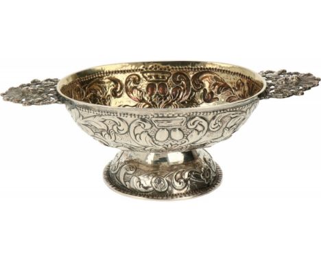 Brandy bowl silver. Beautiful oval-shaped model with gilding and embossed decorations of palm leaves and rocailles as well as