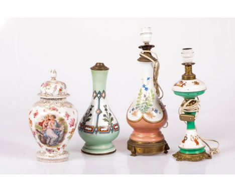 A lot of various porcelain, France &amp; Germany, 20th century. Consisting of three lamp bases and a lidded vase. Estimate: €