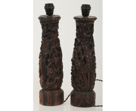 (2) piece set of Balinese coromandel wood lamp bases, Indonesia, 2nd half of the 20th century. Richly carved decorations. Est