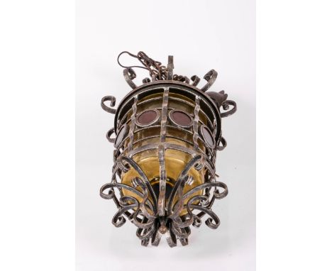 A wrought iron hall lamp, 20th century. With green glass. Meas. H: 47 cm. Estimate: € 30 - € 50.