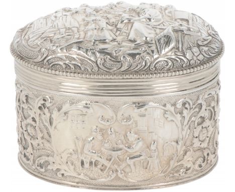 Tea caddy silver. Beautiful oval-shaped model with convex lid with driven decorations, scenes and soldered pearl rim. Netherl