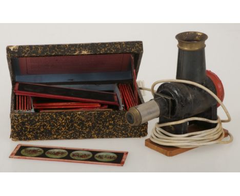 An electrified magic lantern or 'Laterna Magica' and various plates with images in box. Estimate: € 20 - € 60.