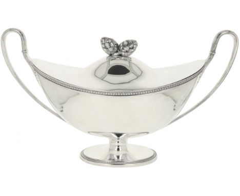 Tureen silver. Very beautiful barge-shaped tureen on an oval-shaped base with rich ivy decoration edges and soldered artichok