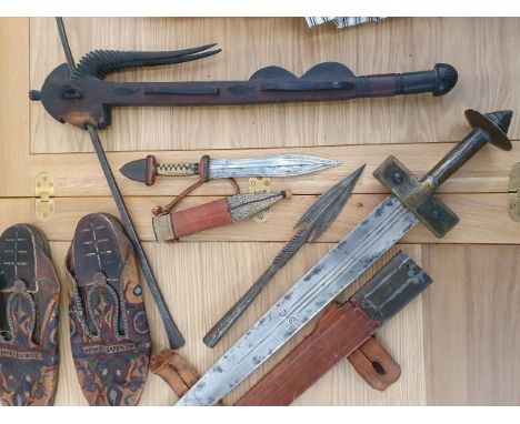 Northern Nigerian tribal art presented to vendors father circa. 1958, including a sword, dagger, battle axe, spear head, shoe