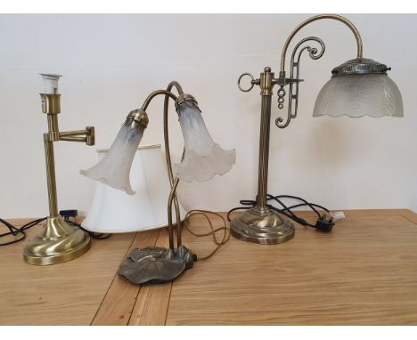 A contemporary table lamp in the form of a lily pad and two other lamps (3).