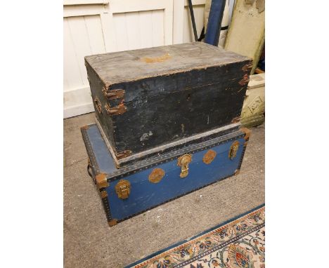 A black painted pine trunk with metal fittings, 74 x 46 cm and a blue school trunk (2).