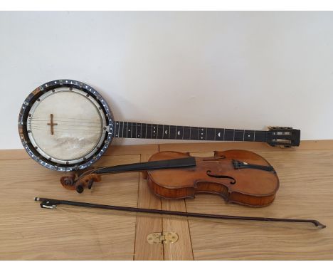 W. Temlett, London, a five string banjo with mother of pearl inlay, numbered 3387, a violin with label 'Stradivarius Cremenon