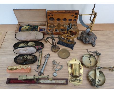 A mahogany cased guinea scale, a Harrison brass sovereign scale and other scales.