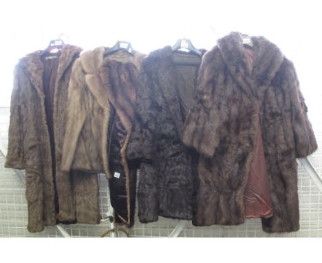 Three vintage brown fur coats, all knee length, one with a 'National Fur Company, Cardiff, Swansea, Carmarthen, Newport' labe