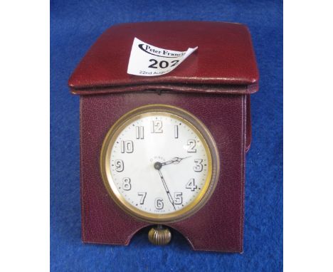 Mid Century leather cased, keyless, open faced eight day travelling clock.(B.P. 24% incl. VAT)