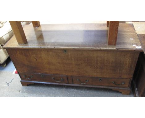 18th Century oak trunk, the hinged lid above two fitted drawers, on bracket feet.(B.P. 24% incl. VAT)   CONDITION REPORT:  Ha