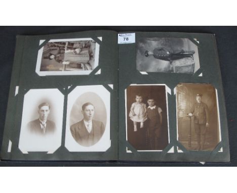 Postcards collection in blue album, topographical with Welsh interest, greetings cards and family portrait cards.(B.P. 24% in