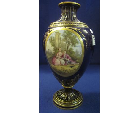 Early 20th Century Continental porcelain urn shaped pedestal vase with reserved, painted panel of 18th Century figures in a l