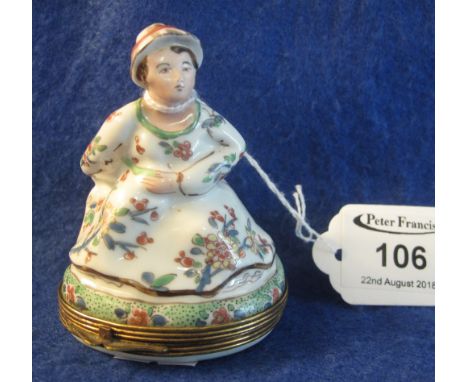 18th Century/early 19th Century enamelled metal and porcelain figural snuff box in the form of a crinoline woman surreptitiou