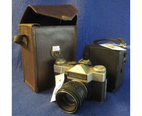 Zenit-E 35mm SLR camera, together with a leather finish, clockwork cine camera in leather box case. (2)(B.P. 24% incl. VAT)